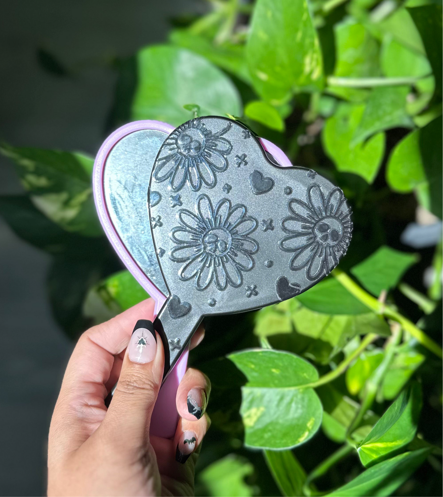 Deadly daisies handheld mirror