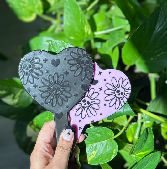 Deadly daisies handheld mirror