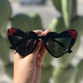Black heart sunnies red web